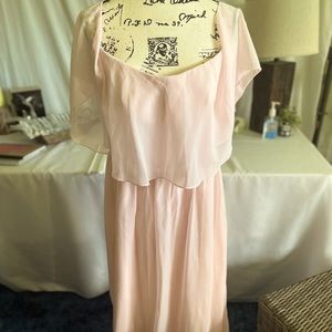 Light pink dress. Long dress.Never been worn does not have the tag and size.